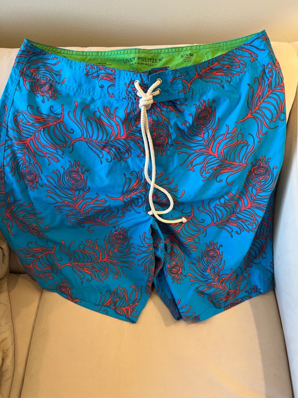 Lilly Pulitzer Teal Swim Shorts with Orange/Red Feather Print